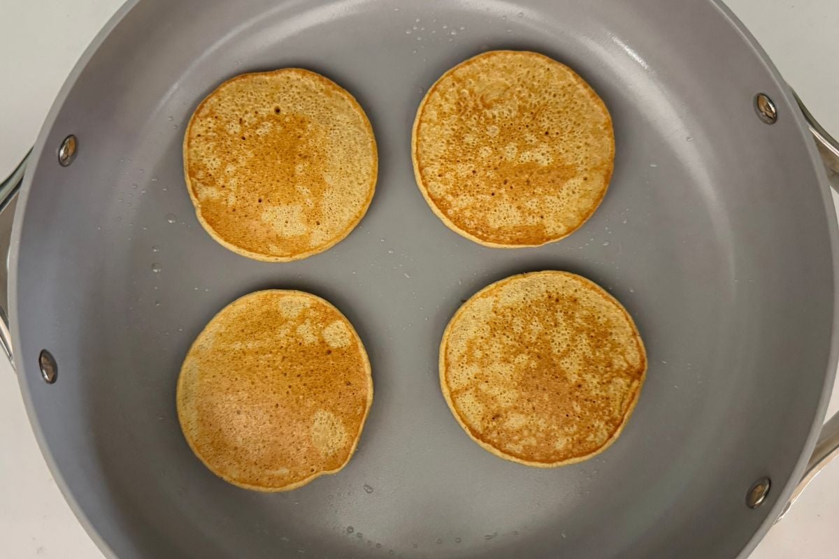Cooked peach pancakes in pan