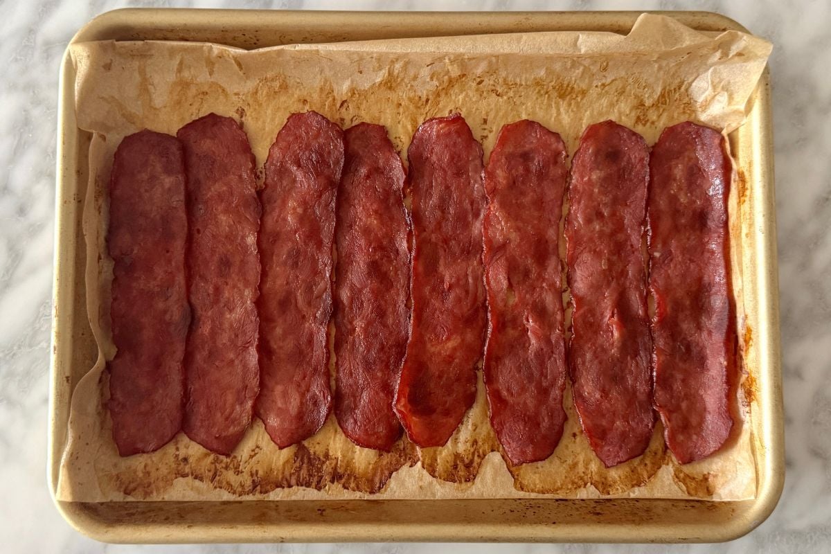 Cooked turkey bacon on a sheet pan