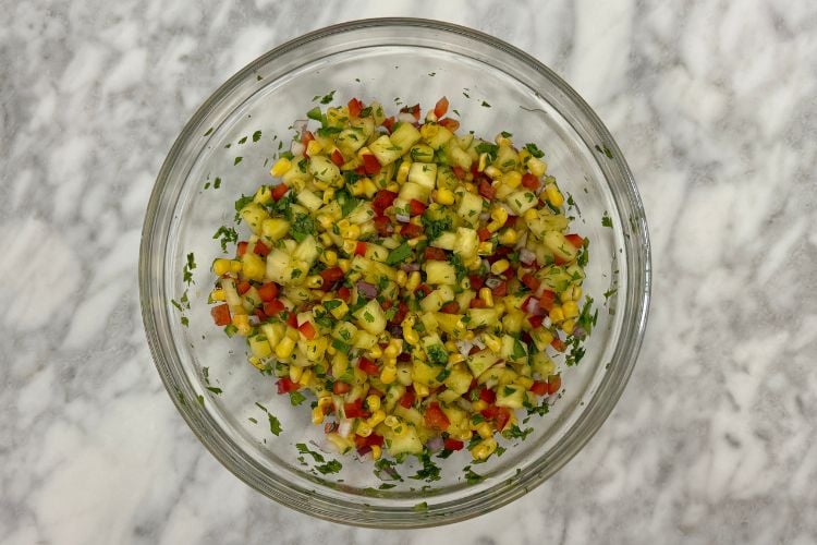 Corn and pineapple salsa in a bowl