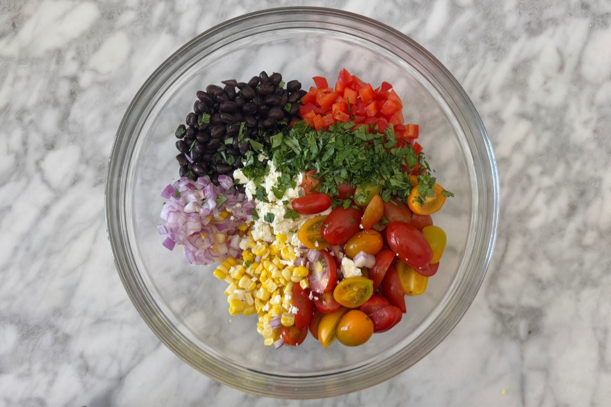 Corn salad ingredients in bowl