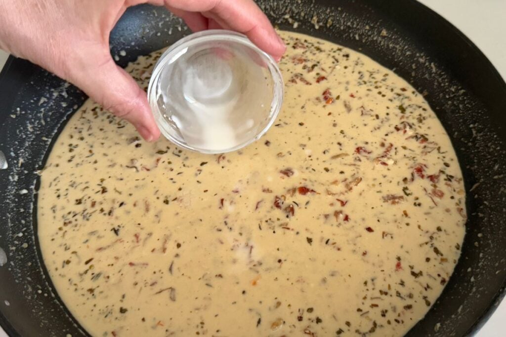 Cornstarch slurry for the creamy sauce in skillet