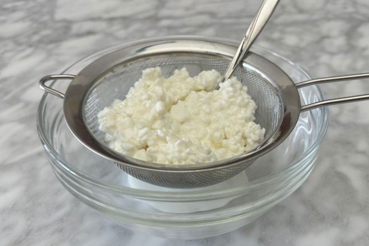 Cottage cheese in a strainer