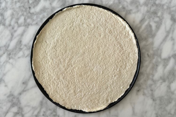 Cottage cheese pizza crust on pizza pan