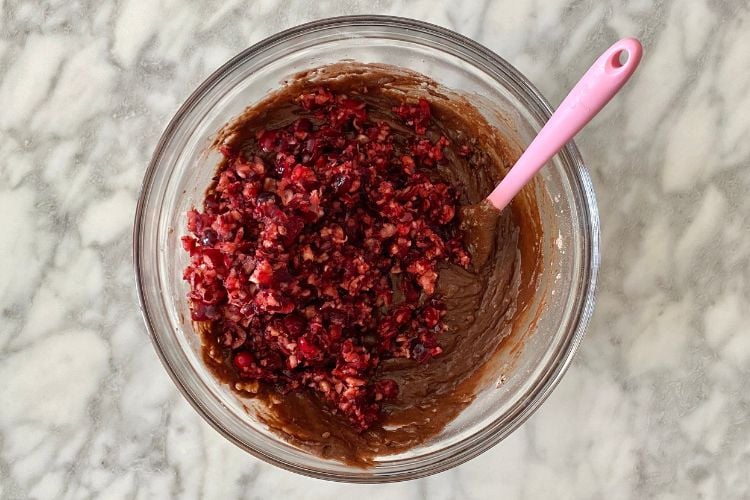 Cranberries in chocolate muffin batter