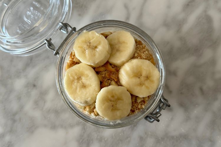 Crushed vanilla wafers and banana slices in a jar