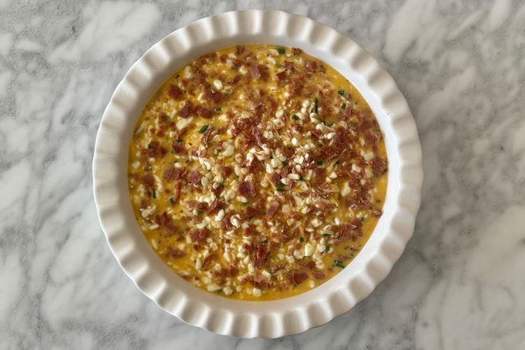 Crustless bacon and cheese quiche in dish