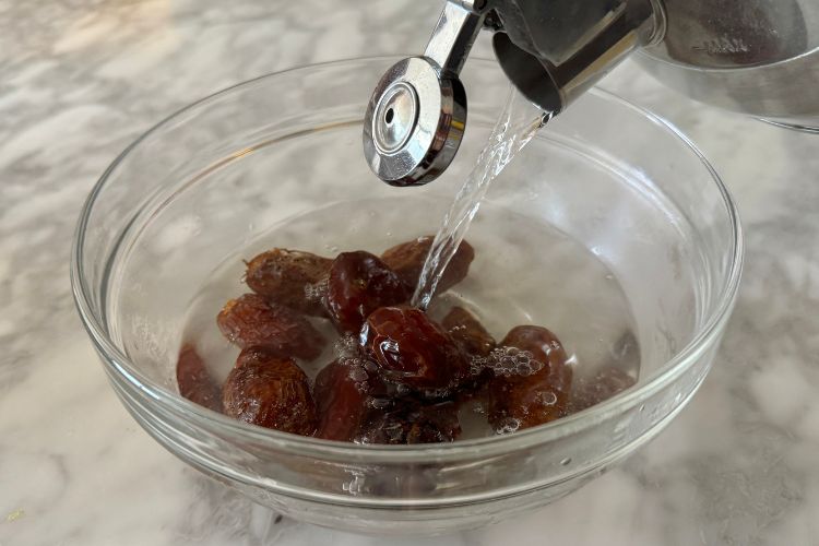 Dates in bowl with water