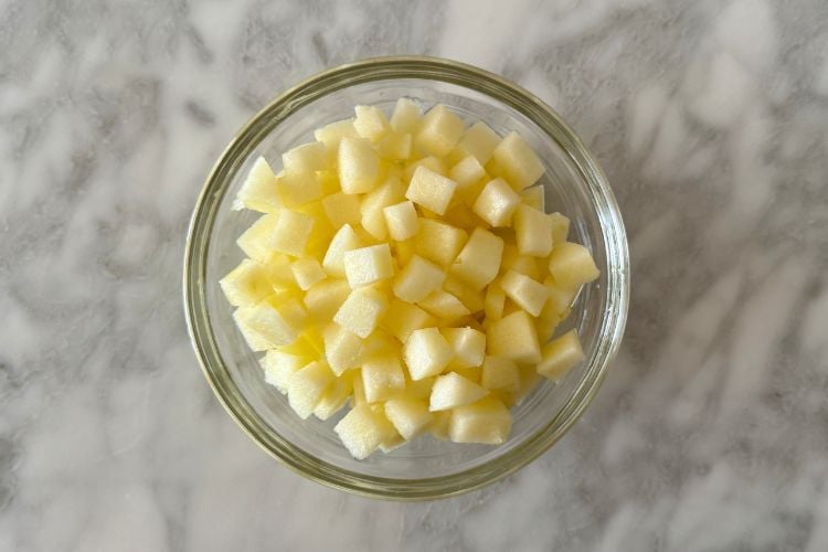 Diced and peeled apples in bowl