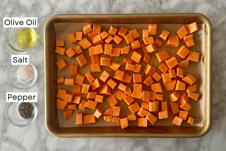 Diced sweet potatoes on a sheet pan