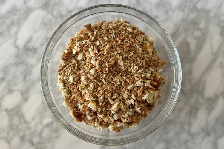 Dried boxed seasoned stuffing mix in bowl