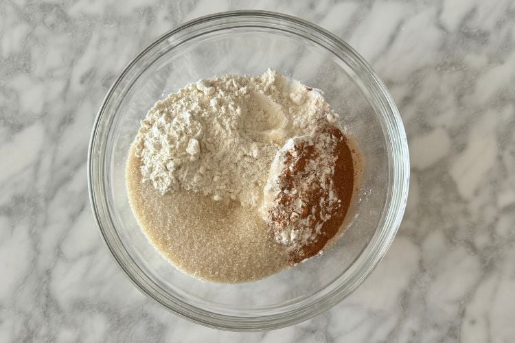 Dry ingredients for apple cinnamon muffins in bowl