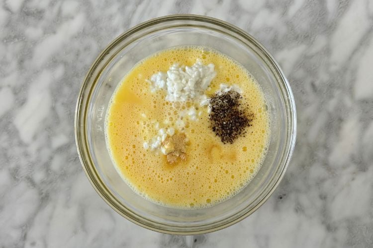 Eggs in bowl with cottage cheese