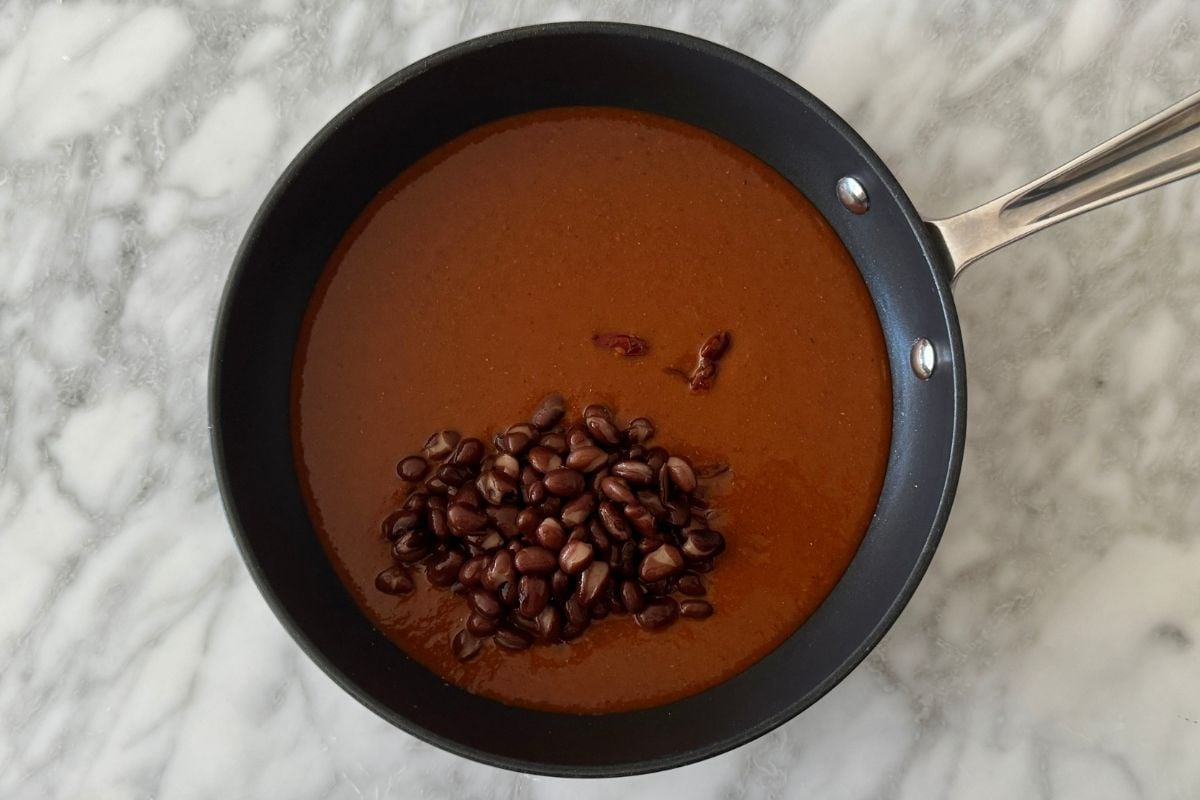 Enchilada sauce in skillet