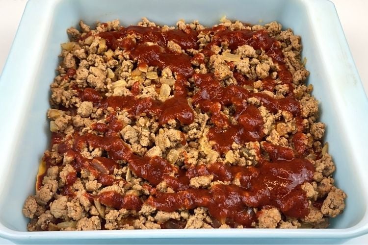 Enchilada sauce on the ground chicken