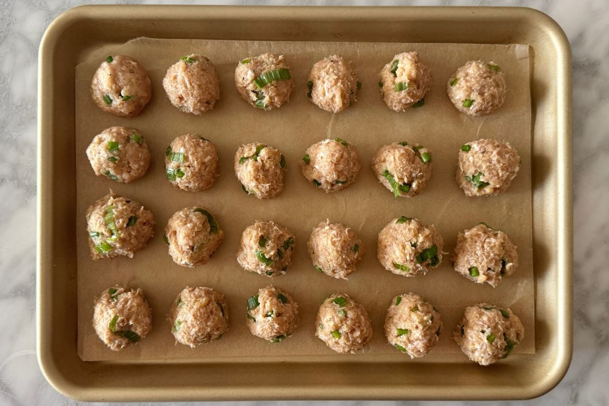 Formed pineapple teriyaki chicken meatballs on sheet pan