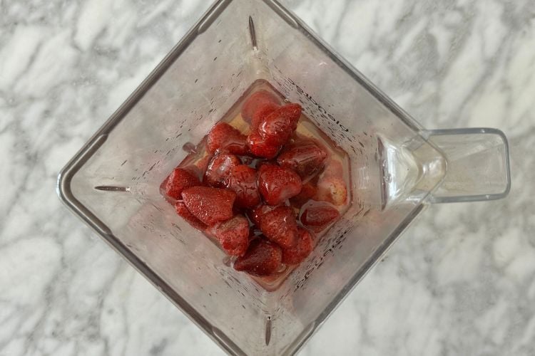 Frozen strawberries and rosé in blender