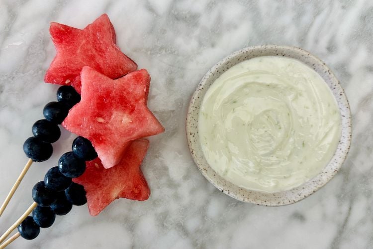 Fruit sparklers with lime yogurt dip