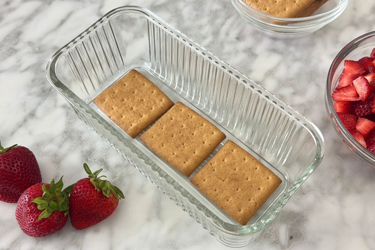 Graham crackers in loaf pan for icebox cake