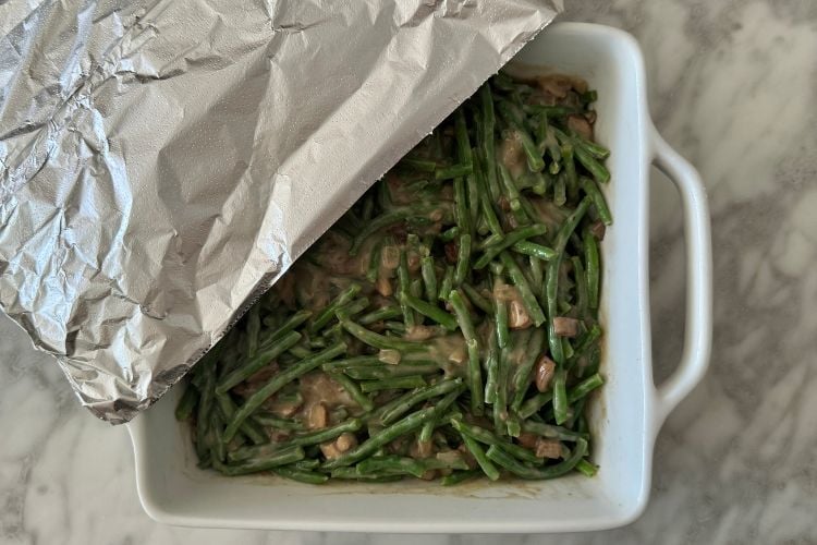 Green beans in dish covered with foil