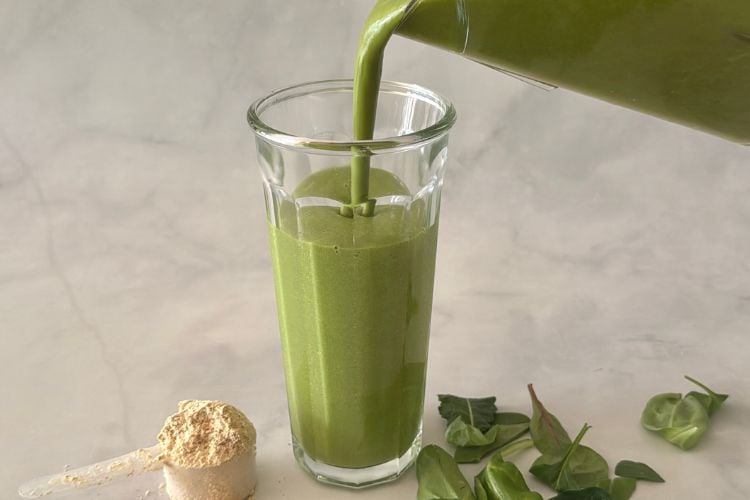 Green protein smoothie in glass