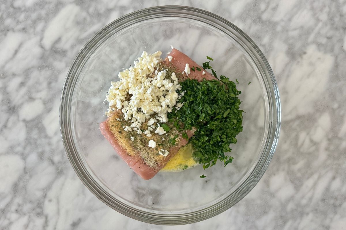 Ground turkey for spinach feta turkey burgers in bowl