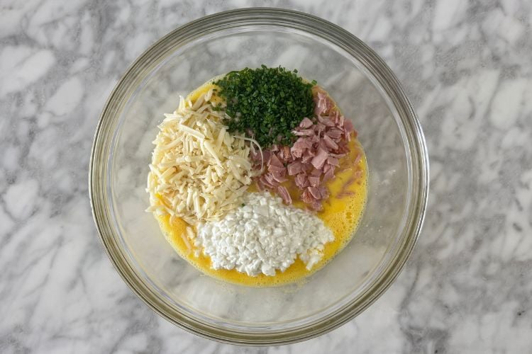 Ham and Swiss cheese quiche in bowl