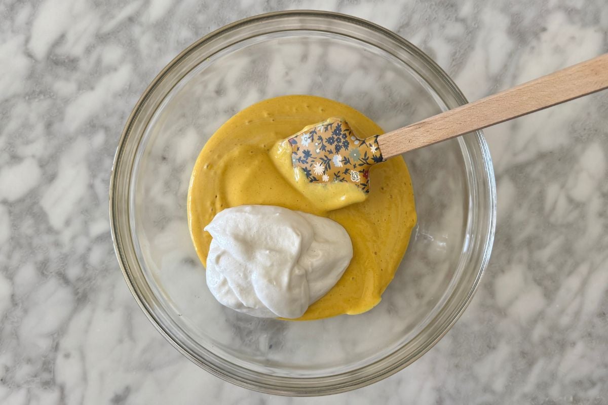 High protein pumpkin mousse in bowl with whipped topping