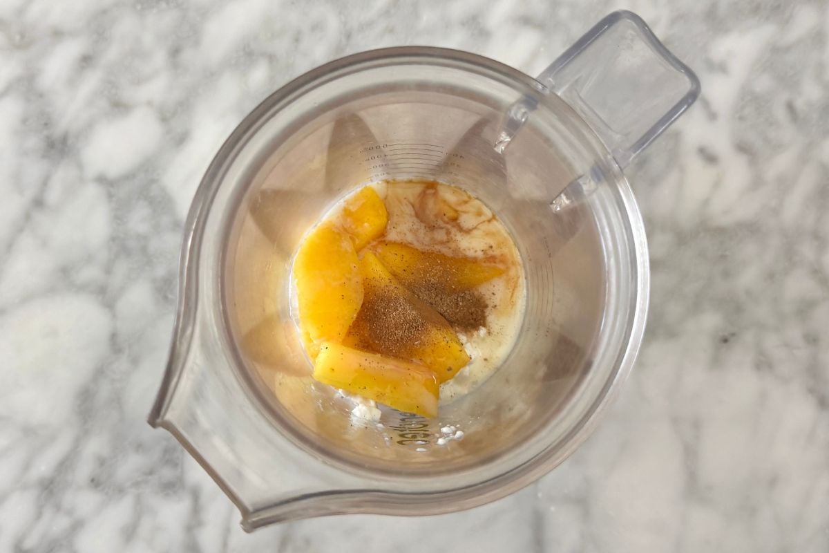 Ingredients for peach overnight oats in blender