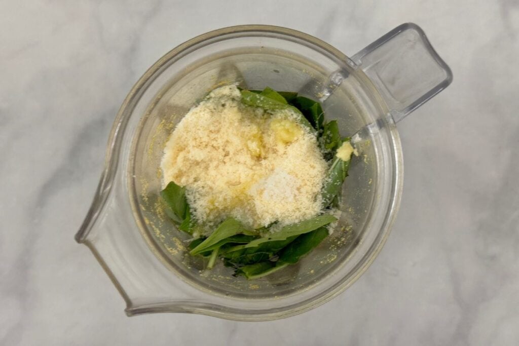 Ingredients for pistachio pesto in a blender