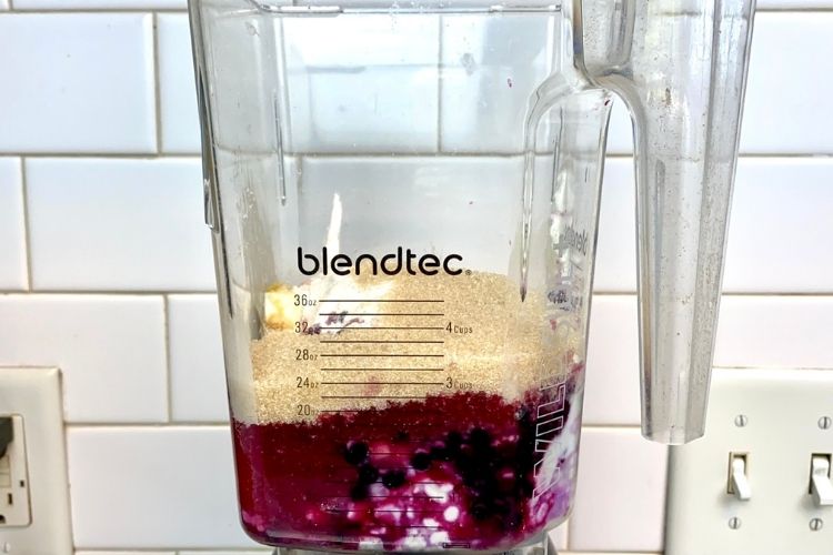 Ingredients for the healthy blueberry cheesecake in the blender