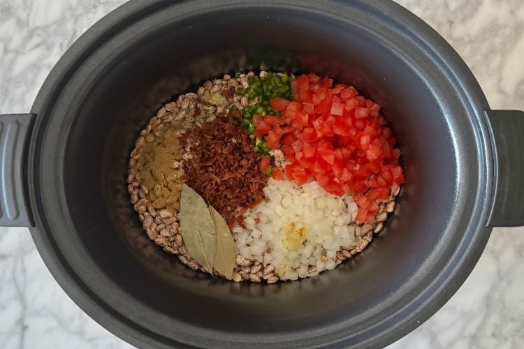 Ingredients in the slow cooker for charro beans