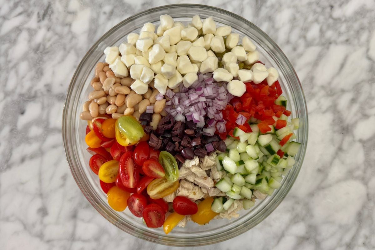 Italian pasta salad ingredients in large bowl