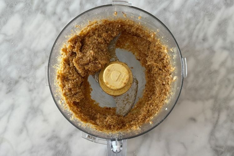 Lemon bliss balls mixture in food processor
