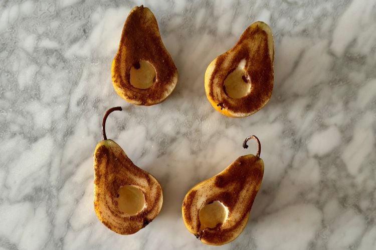 Maple syrup cinnamon mixture on sliced pears