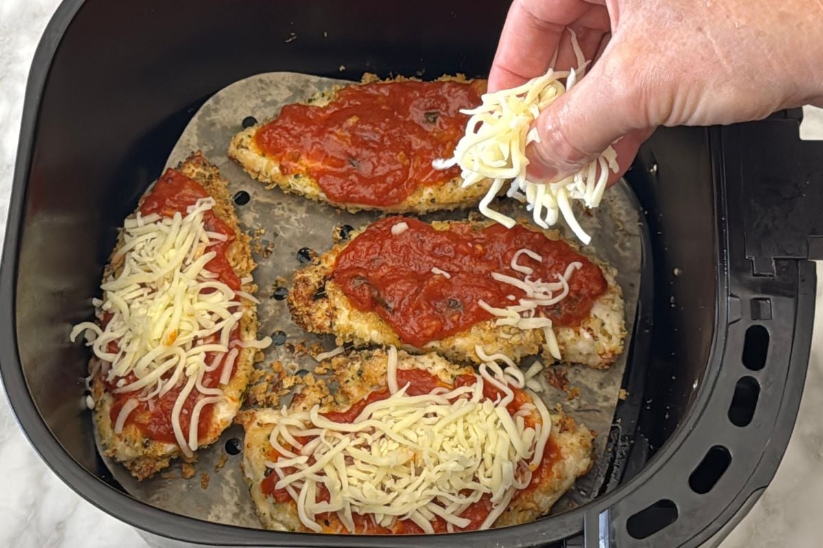 Marinara sauce and light mozzarella on chicken in air fryer