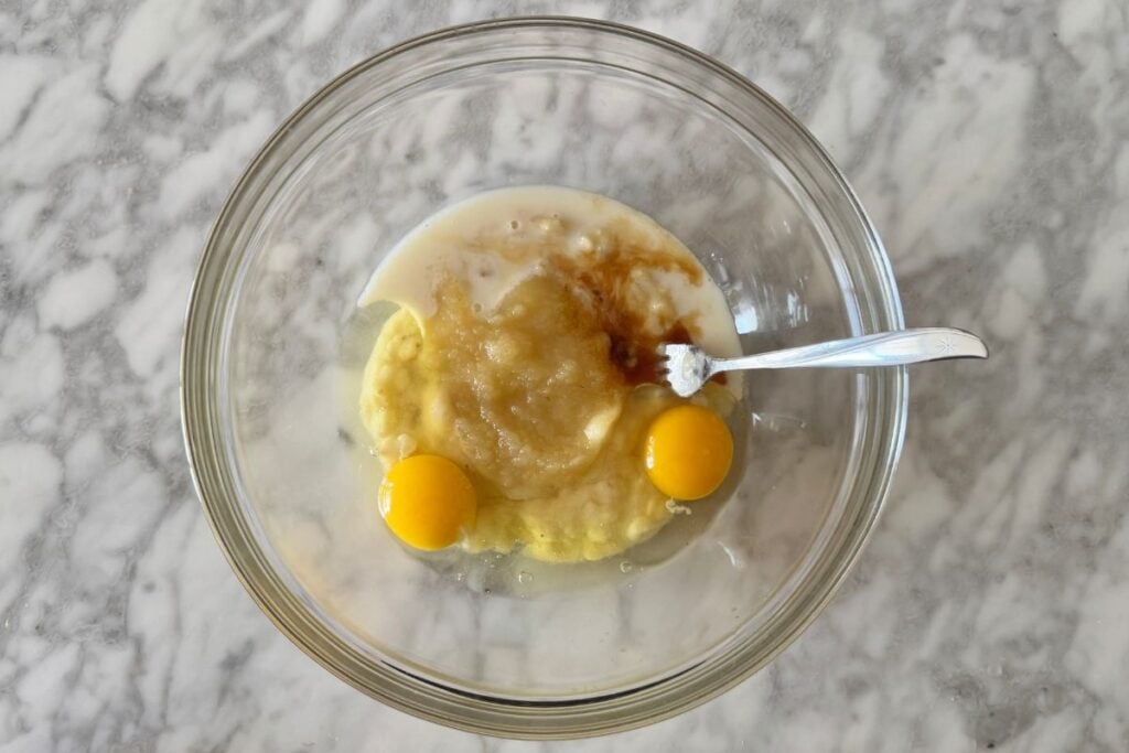 Mashed bananas with wet ingredients for muffins