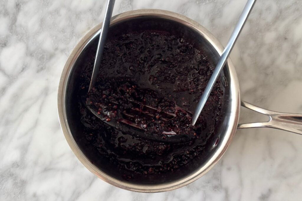 Mashed blackberries in a saucepan
