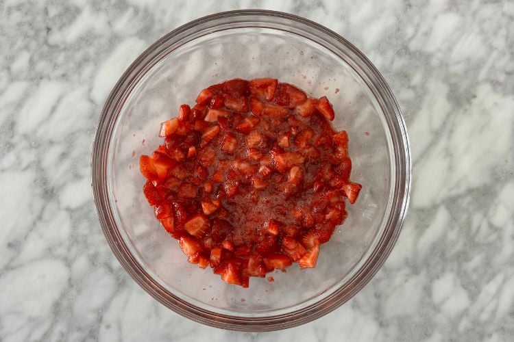 Mashed strawberries in bowl