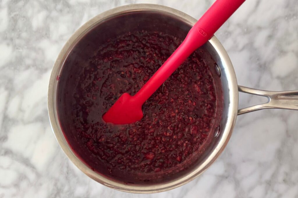 Mixed blackberry compote in saucepan