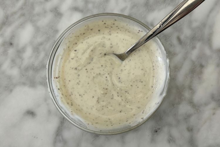 Mixed coleslaw dressing in bowl