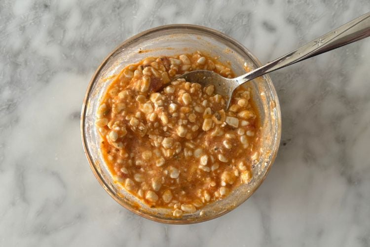 Mixed cottage cheese with sauce in a bowl
