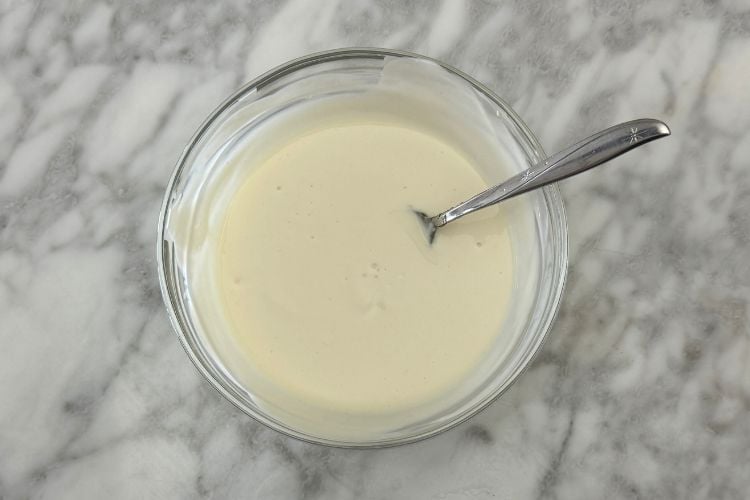 Mixed dressing for carrot salad in bowl