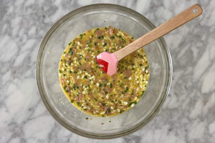 Mixed ingredients for ham and cheese quiche