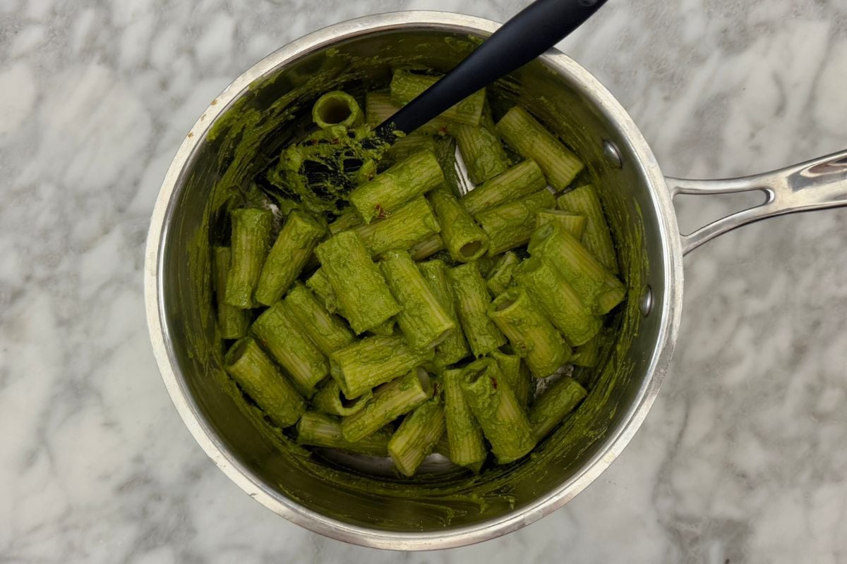 Mixed pasta with pistachio pesto in saucepan