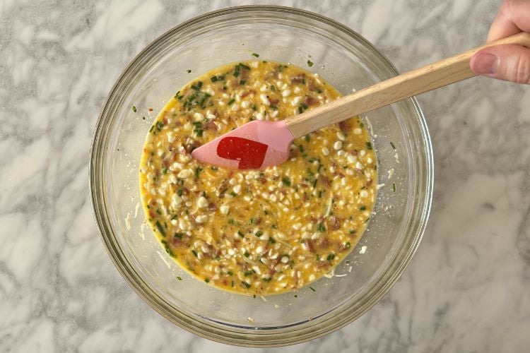 Mixed quiche ingredients in bowl
