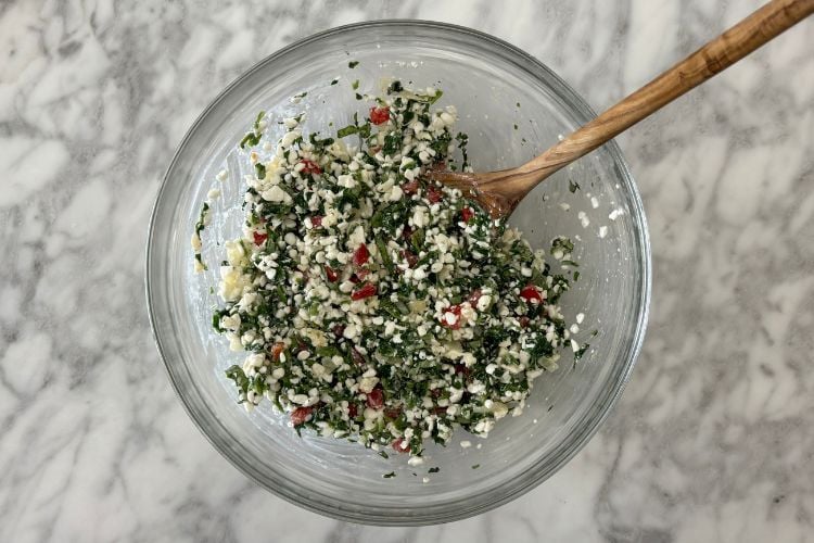 Mixed quiche ingredients in bowl