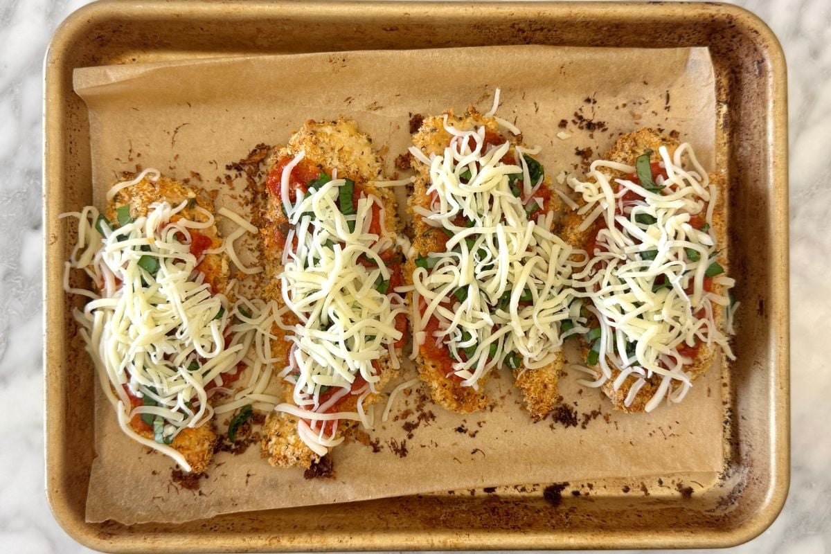 Mozzarella cheese on baked chicken parmesan