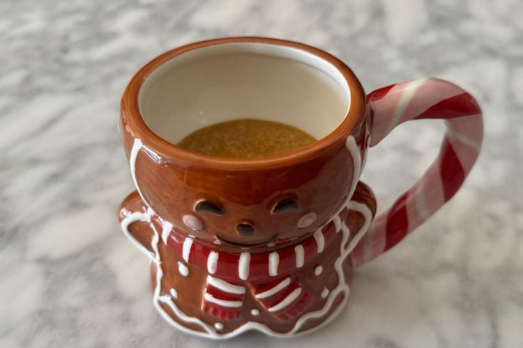 Mug cake batter in a gingerbread mug