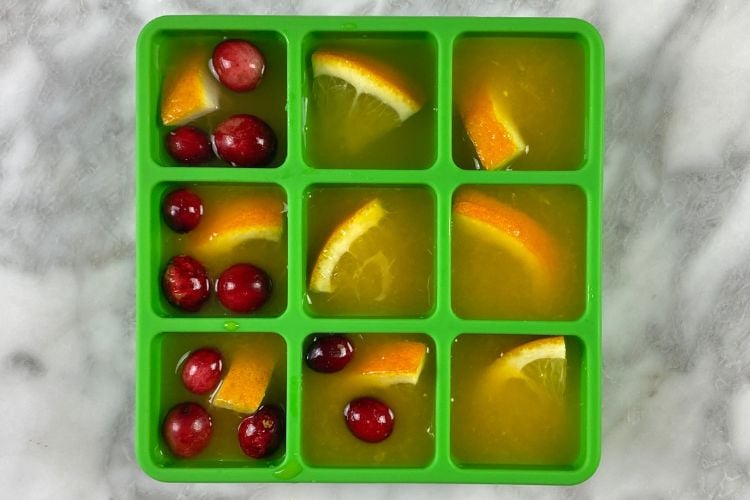 Orange juice in an ice cube tray