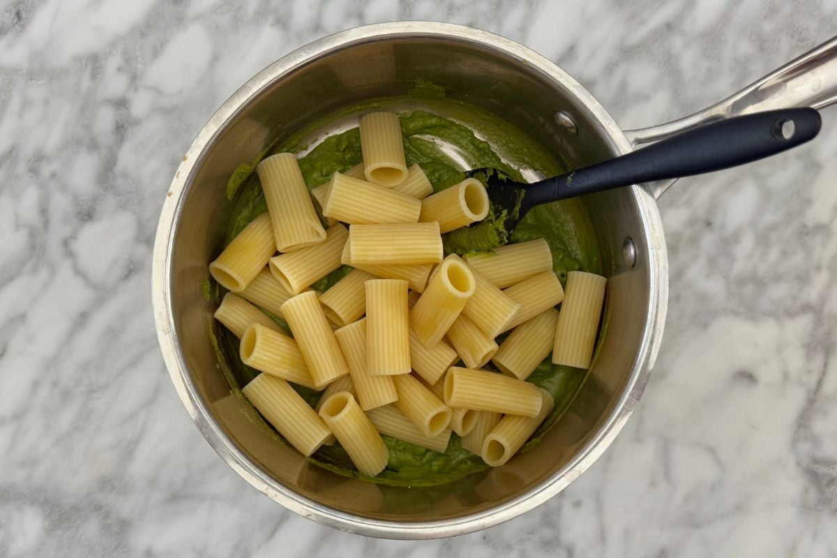 Pasta with pistachio pesto in saucepan